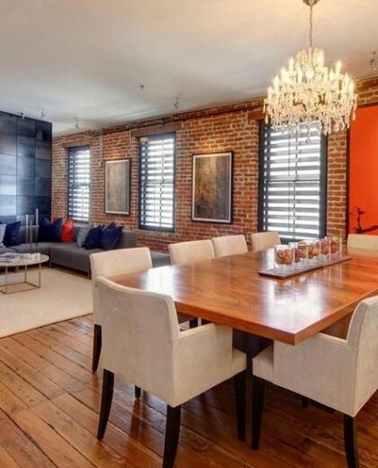 Duplex unit with modern facade and private balconies.
